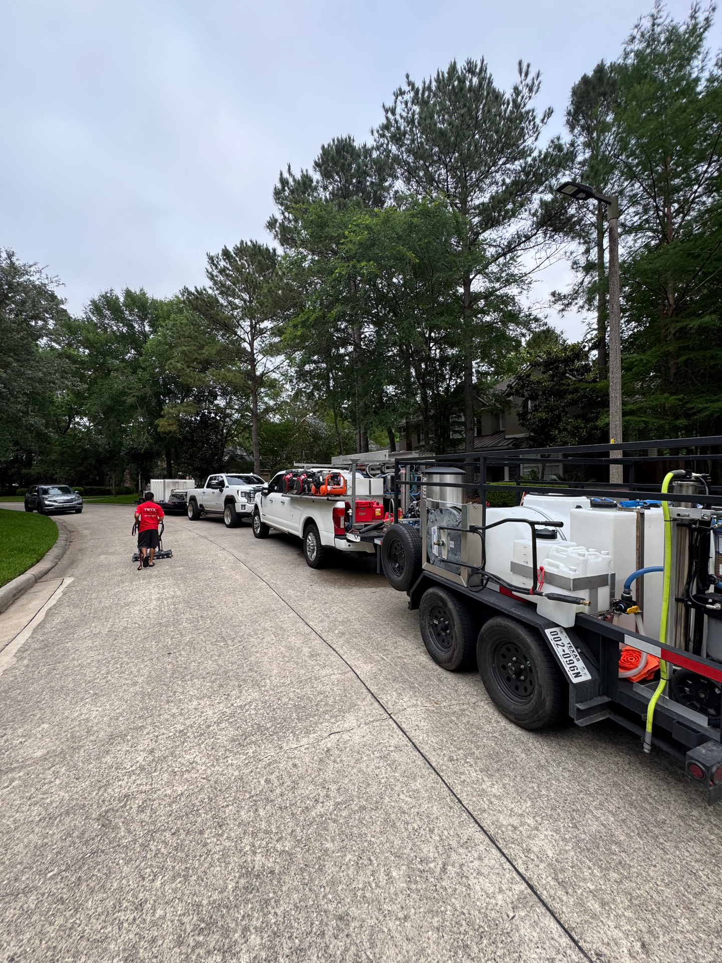 Amazing Power Wash fleet lined up in a residential neighborhood